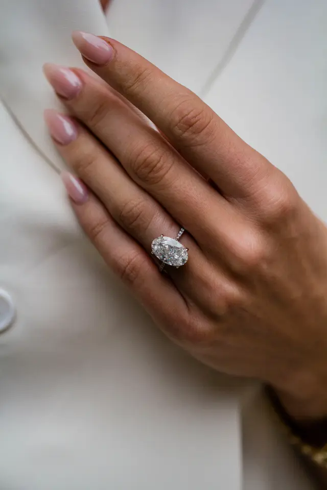 7.75 Carat Oval Cut with 3/4 infinity pave band and Hidden Halo