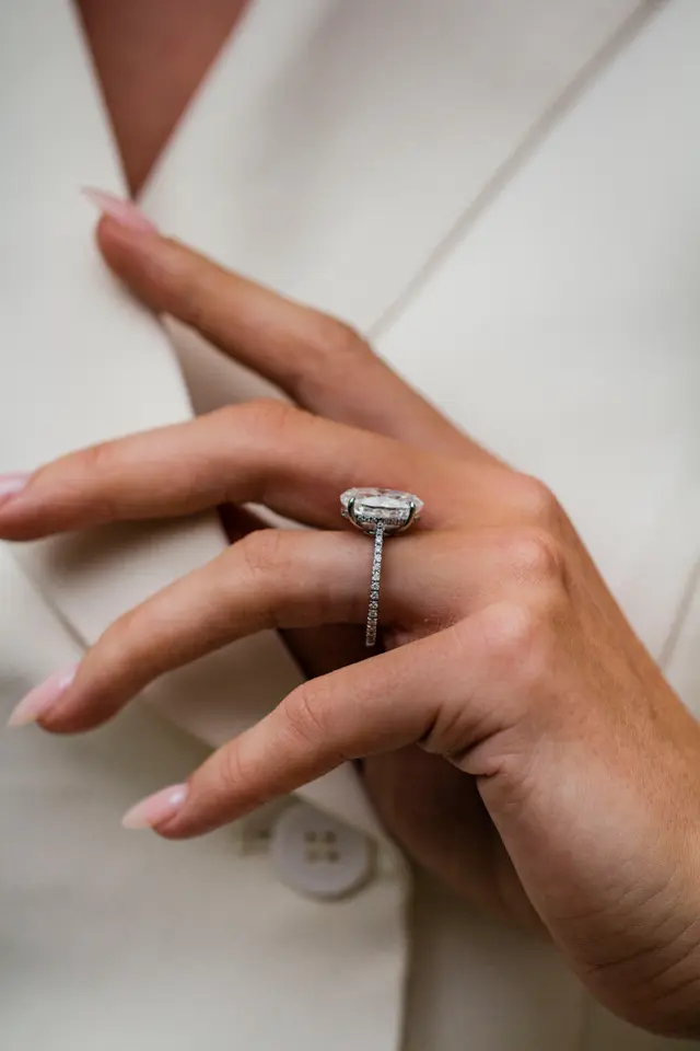 7.75 Carat Oval Cut with 3/4 infinity pave band and Hidden Halo