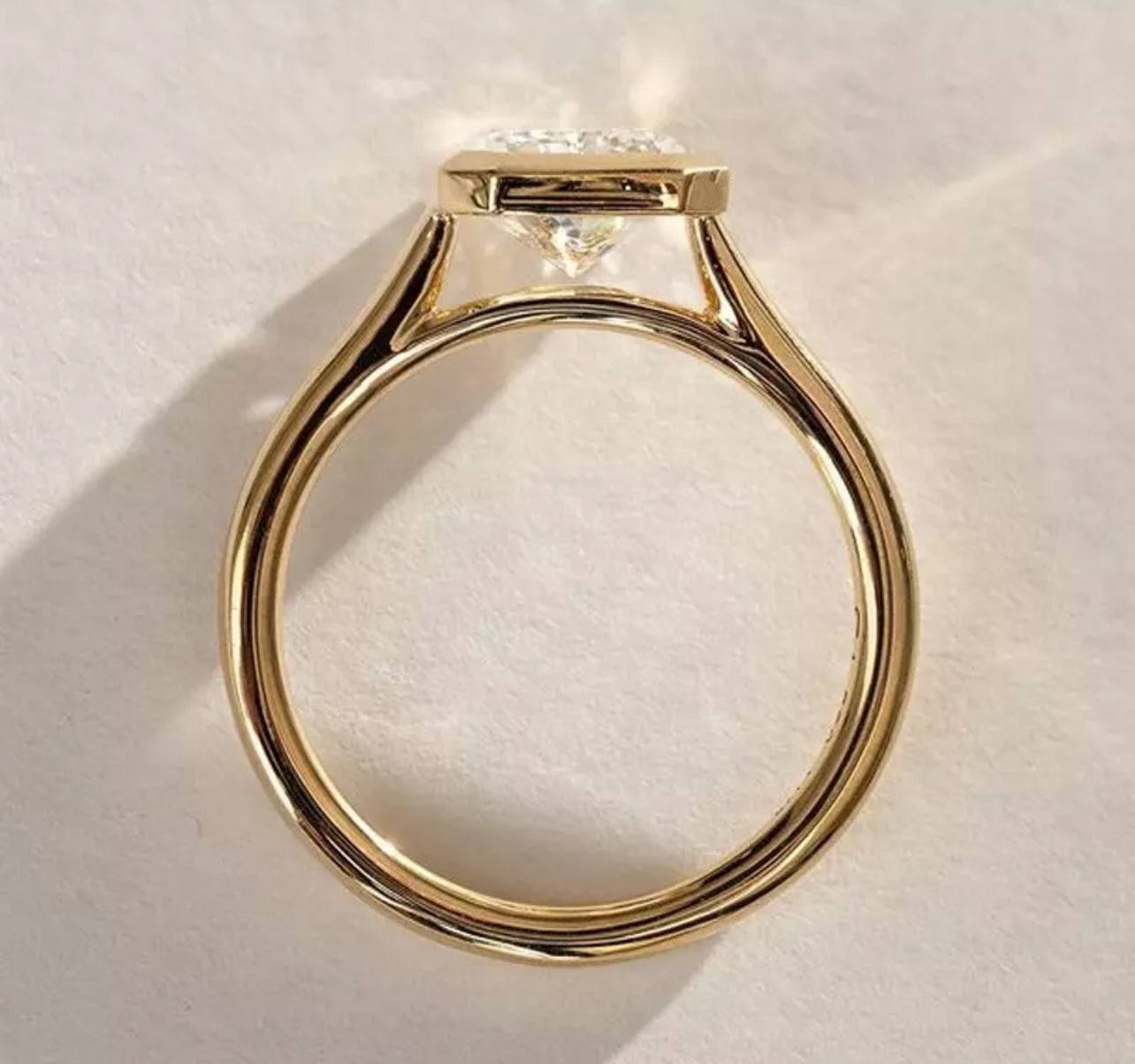 3 Carat Radiant Cut with a solitaire band and bezel setting