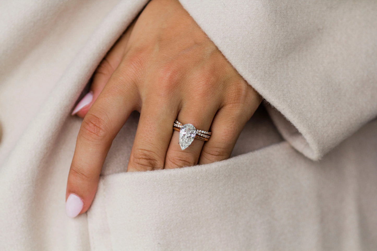 3 Carat Pear Cut Moissanite Diamond Engagement Ring with a Solitaire Band and Shoulder Accents
