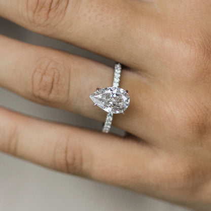 3 Carat Pear Cut Hidden Halo Moissanite Diamond Engagement Ring with a Pavé Band