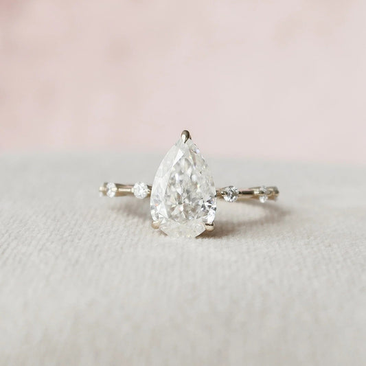 2.5 Carat Pear Cut Diamond Ring with Rount Accents