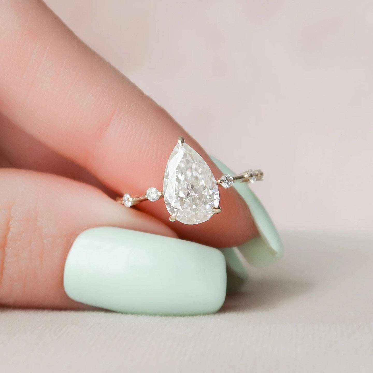 2.5 Carat Pear Cut Diamond Ring with Rount Accents