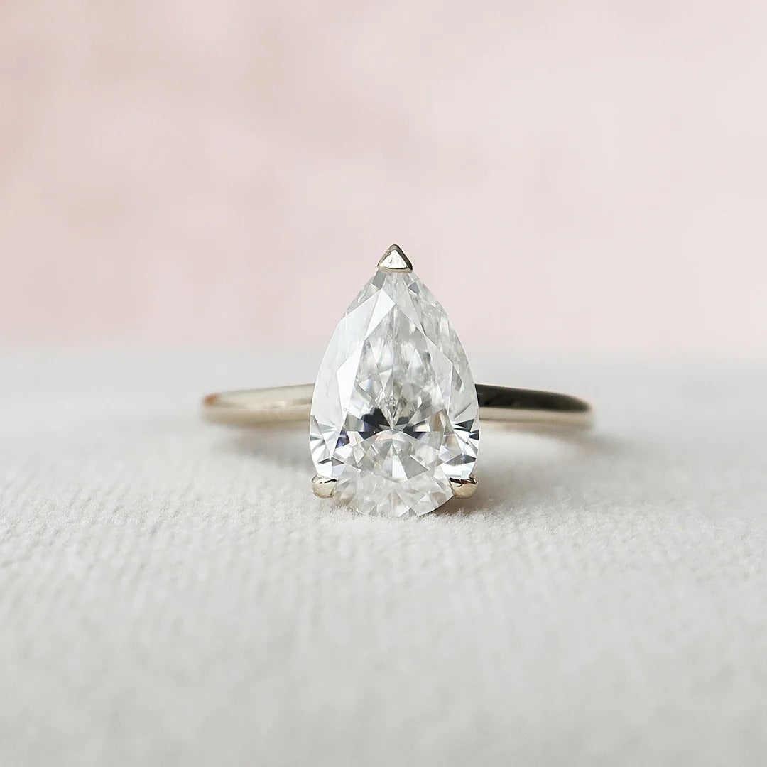 3 Carat Pear Cut with a Solitaire Band, Hidden Halo and Shoulder Accents