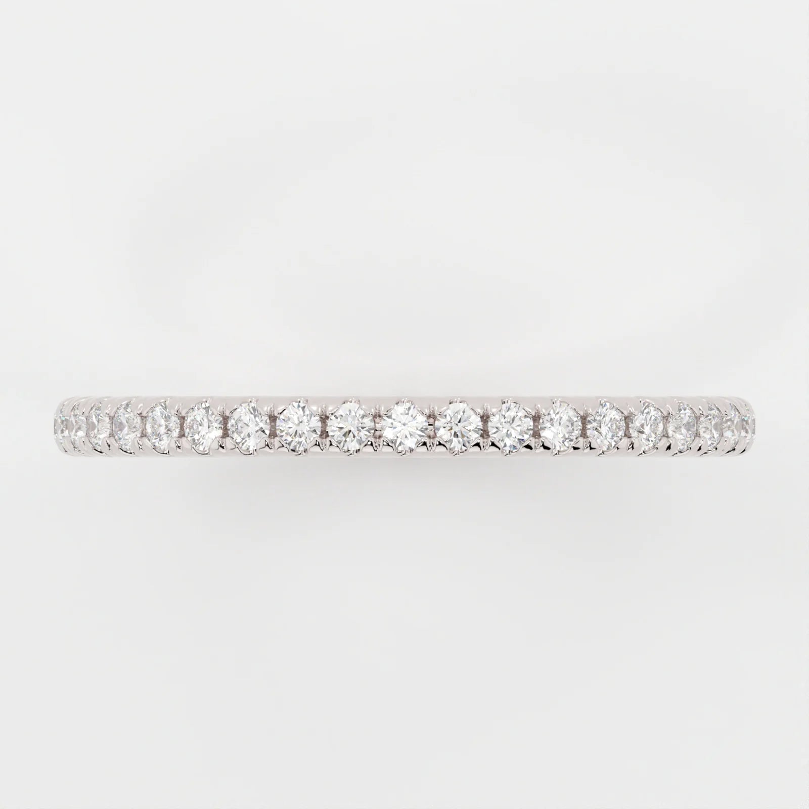 (.75 CT T.W.) Round Cut - Shared Prongs - Reflections Jewelers