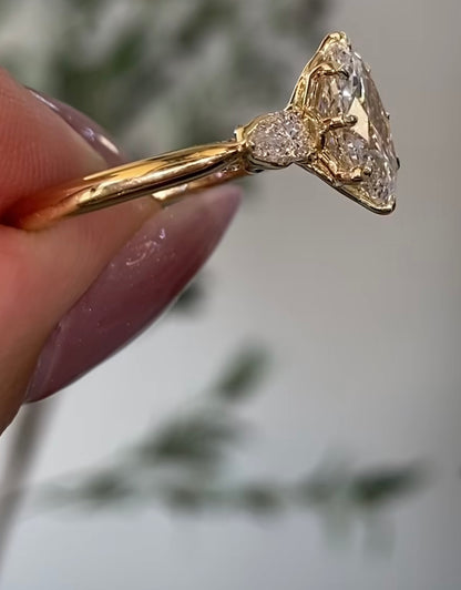 3-Stone Oval Ring with pear side stones and a shoulder accent