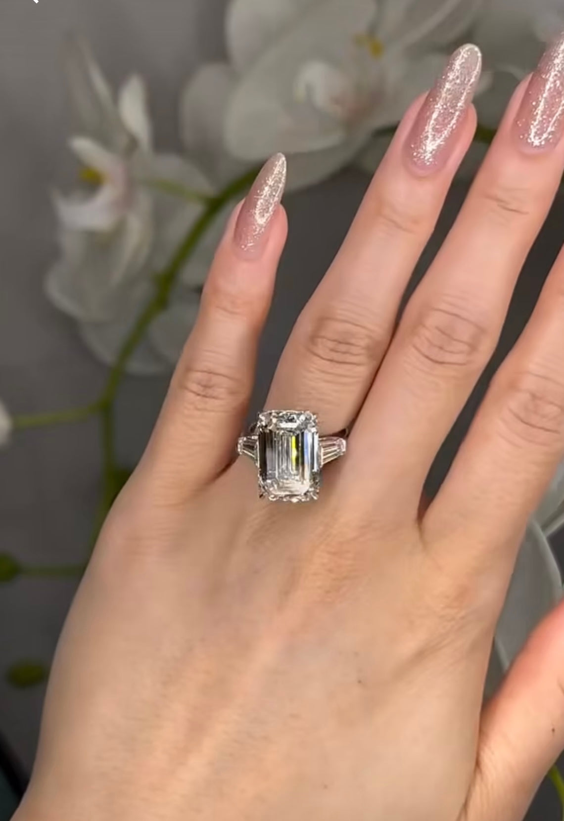 5 CT Emerald Cut with 2 Side Stones and a Solitaire Band