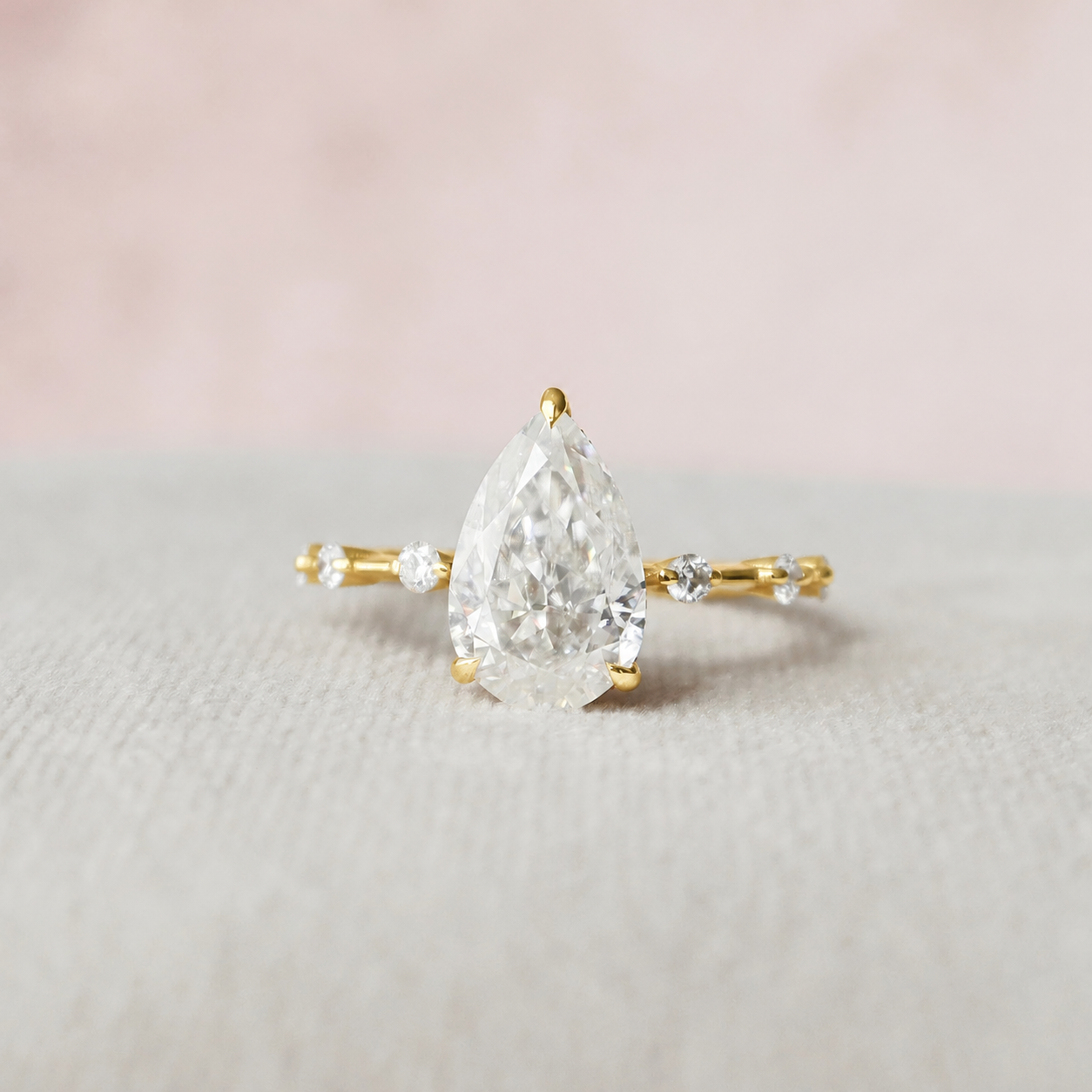2.5 Carat Pear Cut Ring with Round Accents in yellow gold