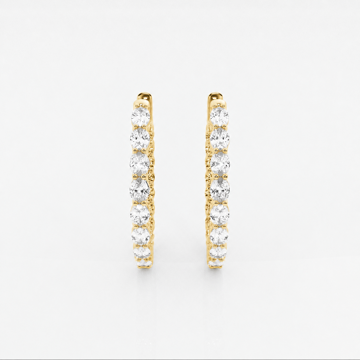 Oval Moissanite Inside Out Hoop Earrings – 2 CTW in yellow gold