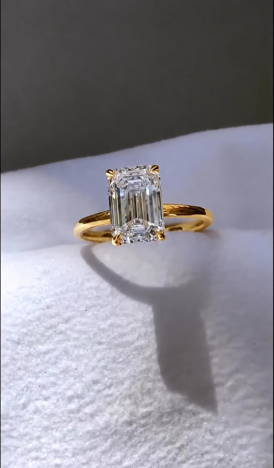 2 Carat Emerald Cut with a Solitaire Band in yellow gold